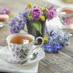 cup-of-tea-GettyImages-518337479 Spring bouquet among teacups and macarons on table